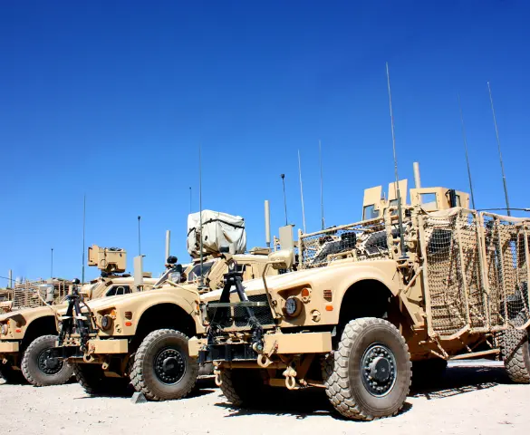 tan military fleet of trucks in the desert photos of a fleet of military trucks in the desert